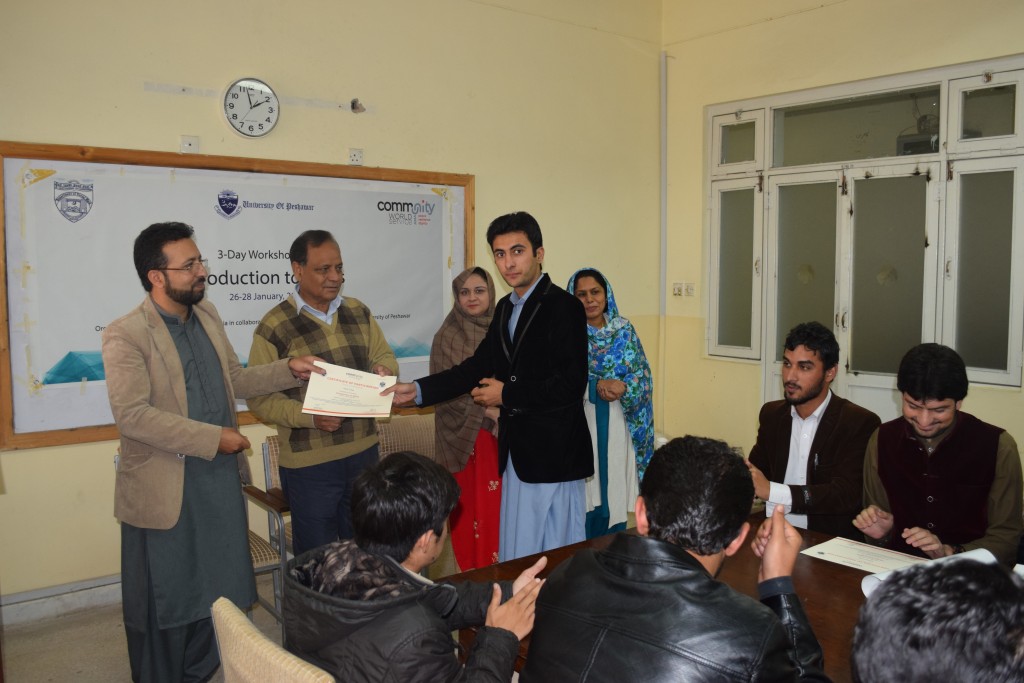 5 Mr. Rizwan Iqbal (Project Coordinator – CIP) presenting a certificate to one of the participants of the training at the University of Peshawar
